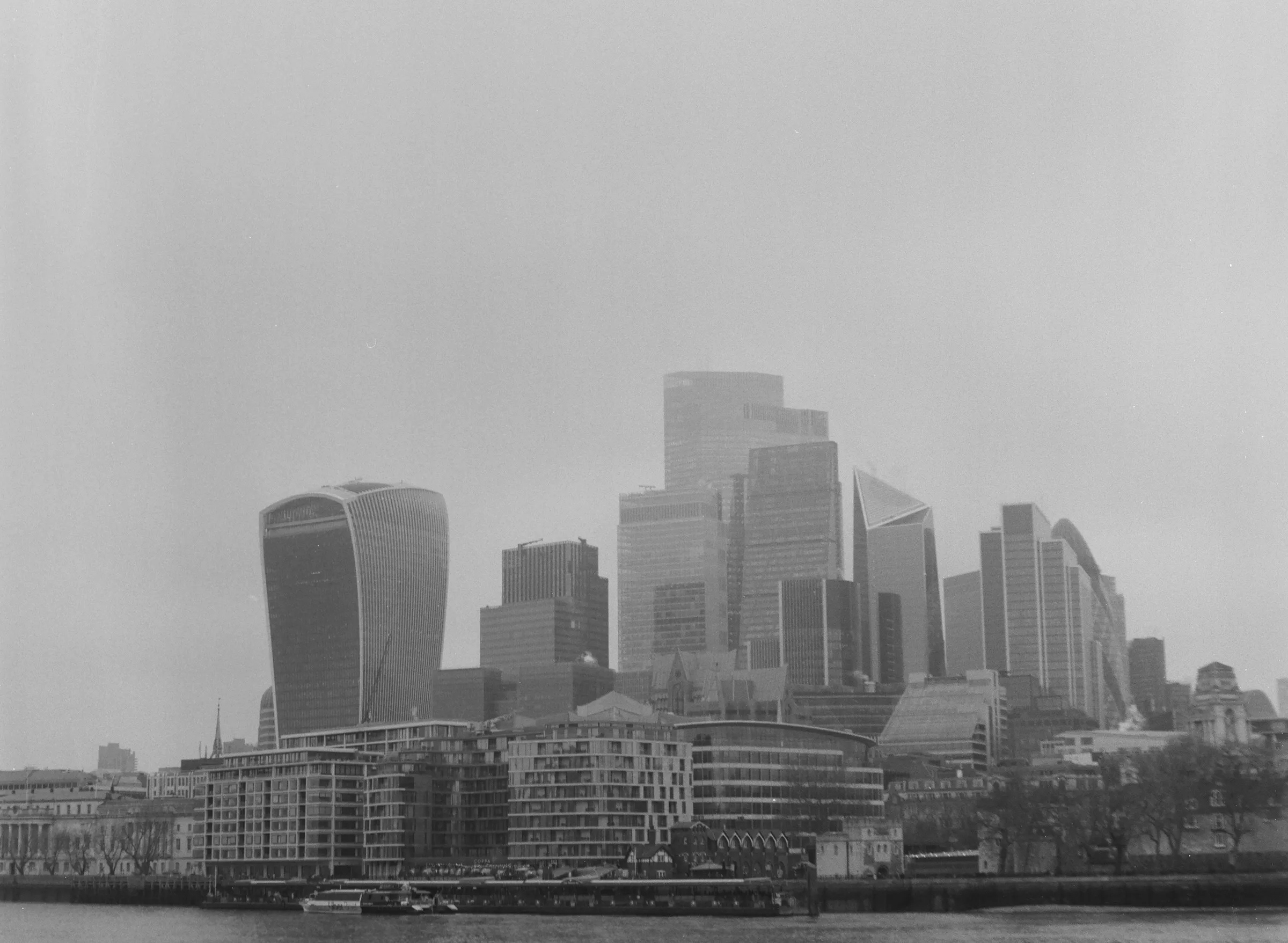 London financial district skyline in morning fog